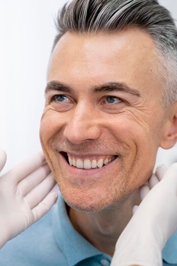 men smiling at dental